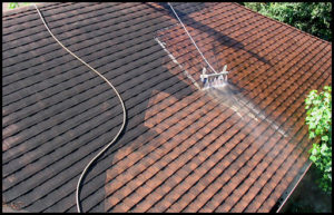 Roof being power washed.
